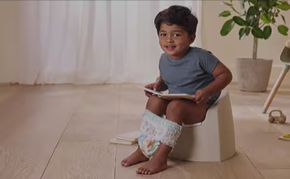 Toddler at potty training stage wearing Pampers leakproof night diaper