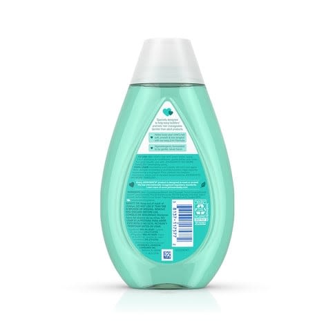 A green bottle of Johnson's baby shampoo stands upright against a white background. Text reads: "Johnson's, champú para bebé, sin parabenos" and a small white triangle symbol, "200 ml".
