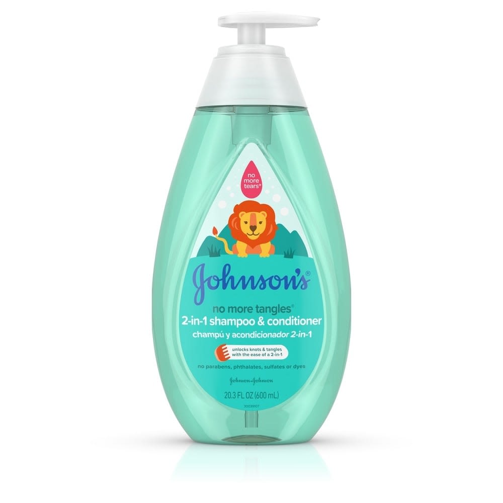 A light blue, oval-shaped bottle with a white pump dispenser labeled "Johnson's 2-in-1 Shampoo & Conditioner" features a lion illustration. It stands against a plain white background. Text says, "No more tangles."