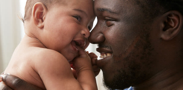 Johnson's Baby father and baby smiling together image