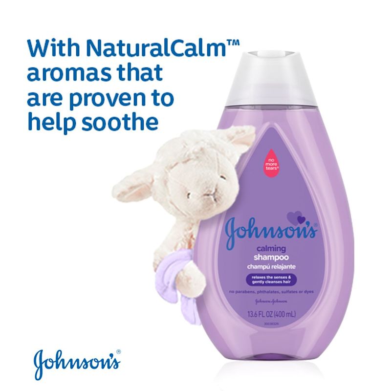 Johnson's Calming Shampoo bottle in purple packaging with a stuffed lamb, stating it has NaturalCalm aromas that help soothe, 13.6 FL OZ (400 mL).