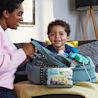 Mother and child packing a bag with a Johnson's Tiny Traveler Baby Gift Set, including four baby products and a free travel clutch.