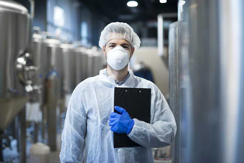 Auditor with mask and hairnet