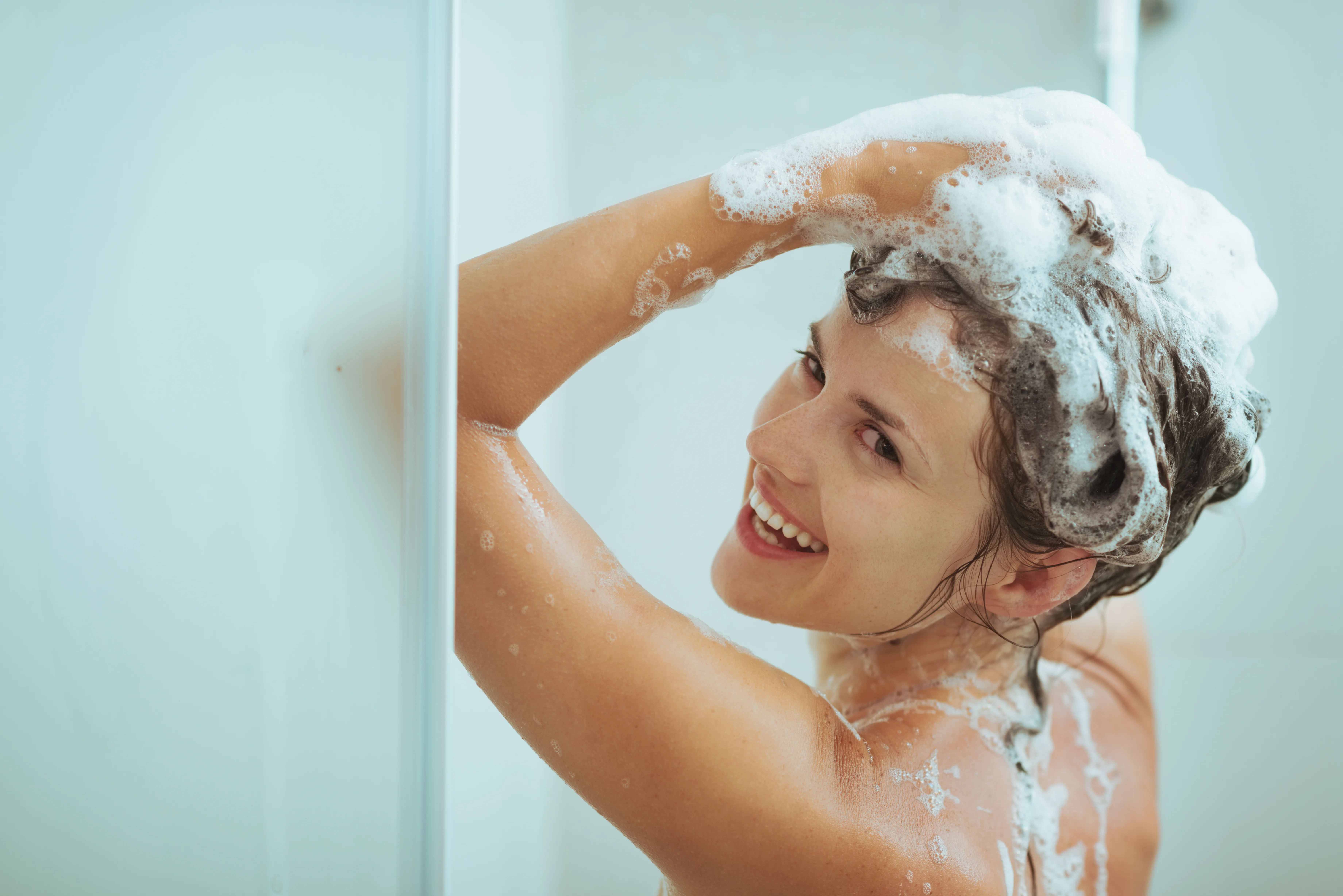 Woman Applying Head and Shoulders Shampoo