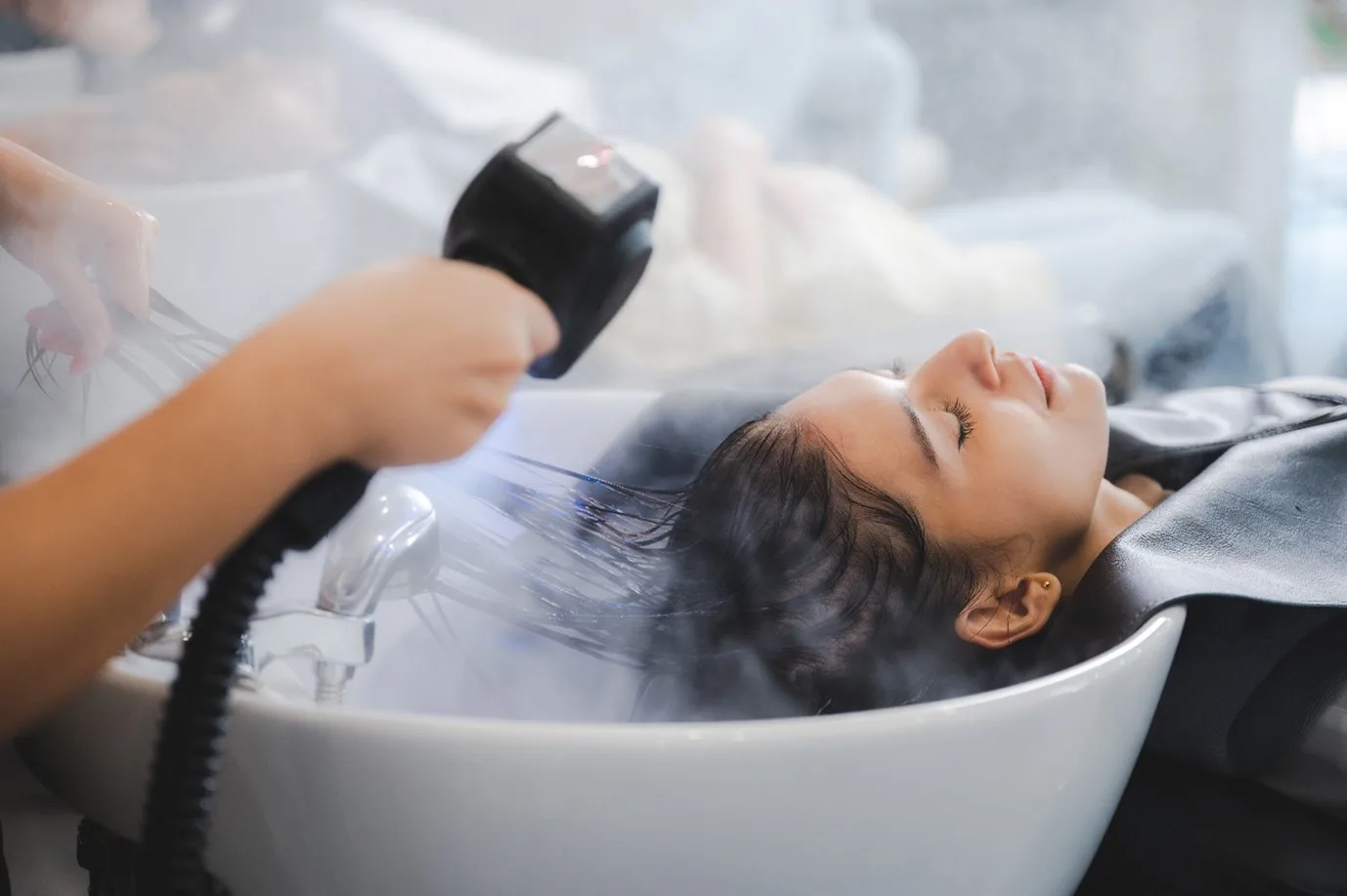 Woman getting a hair spa