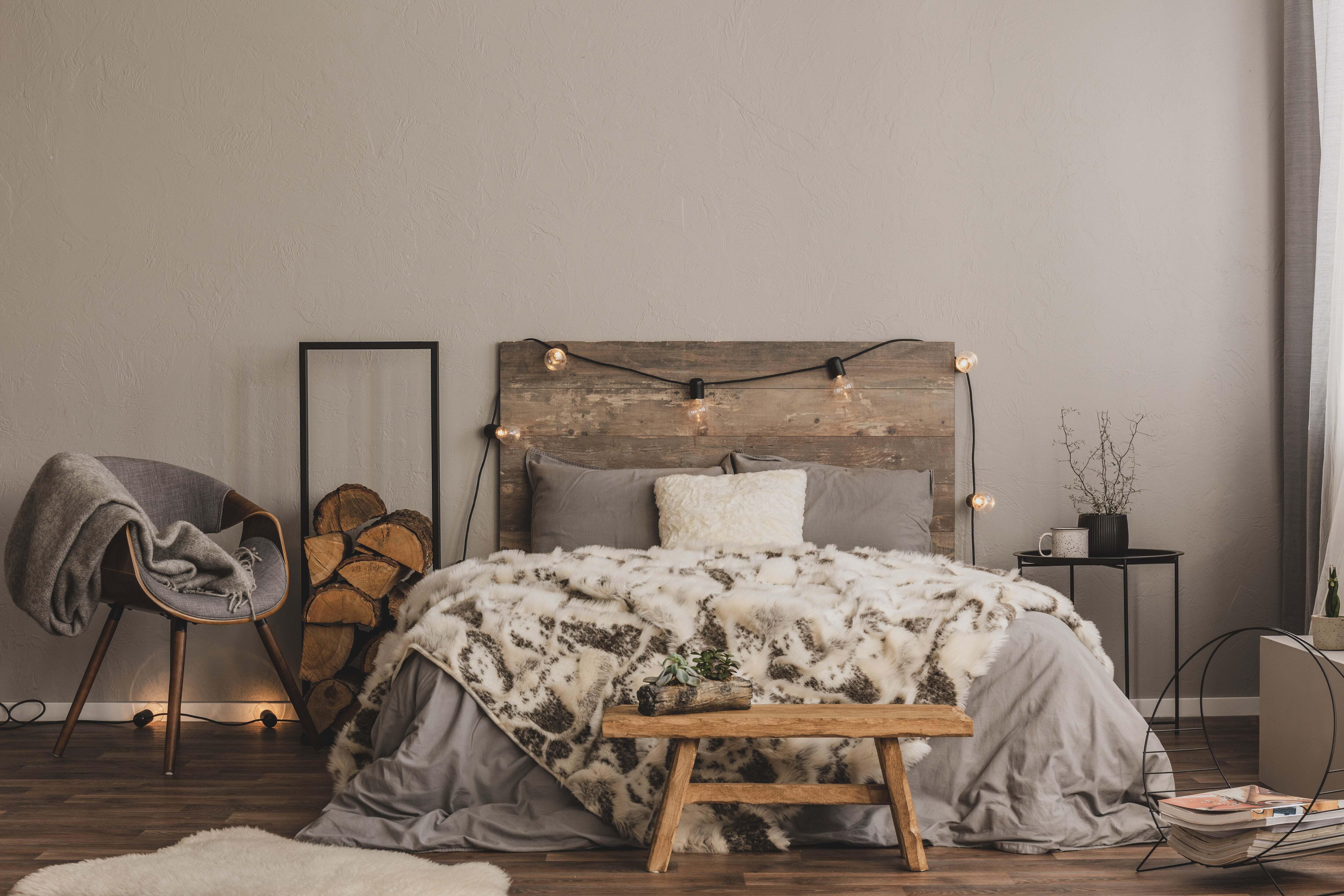 A cozy bed with a fur blanket