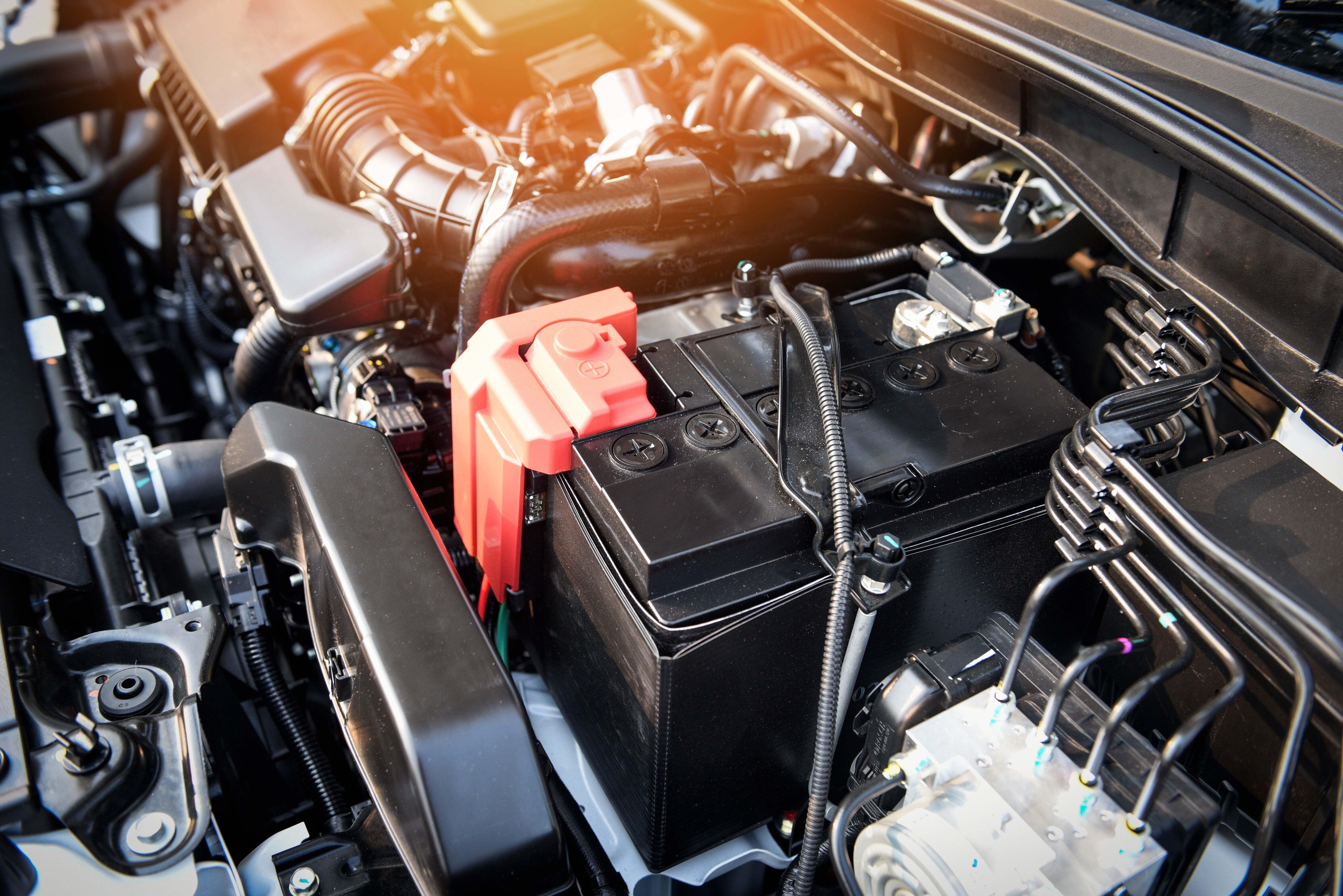 Image of a car battery underneath the hood