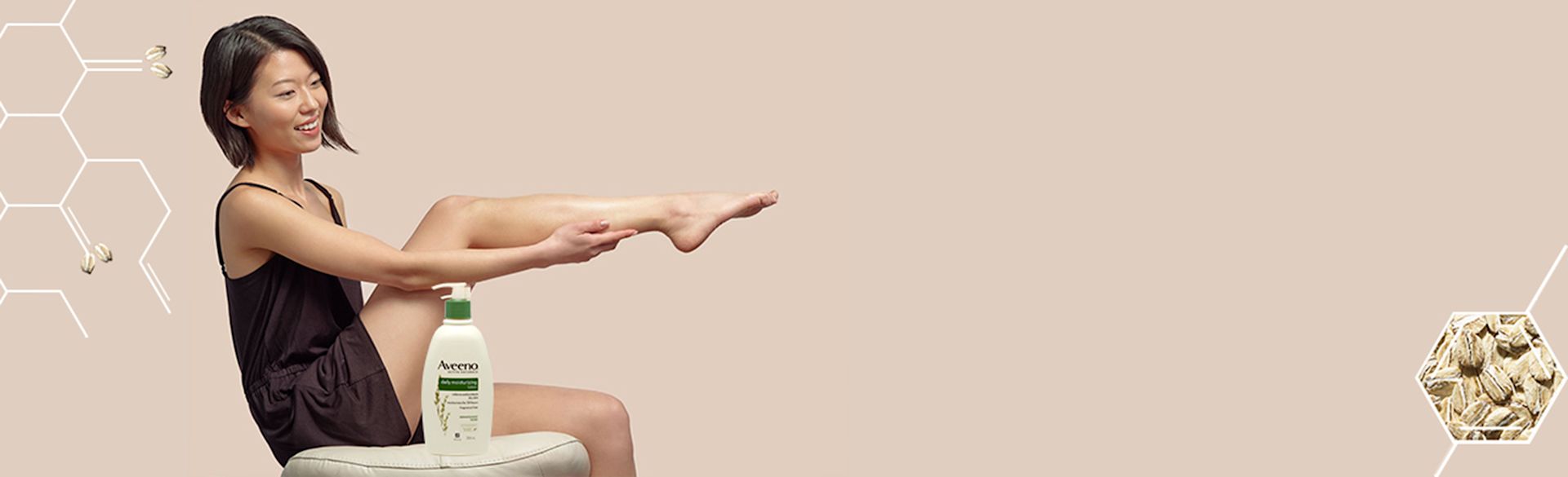 newbody-landing_talent-seated-holding-legs-looking-right_1-th-th-Aveeno
