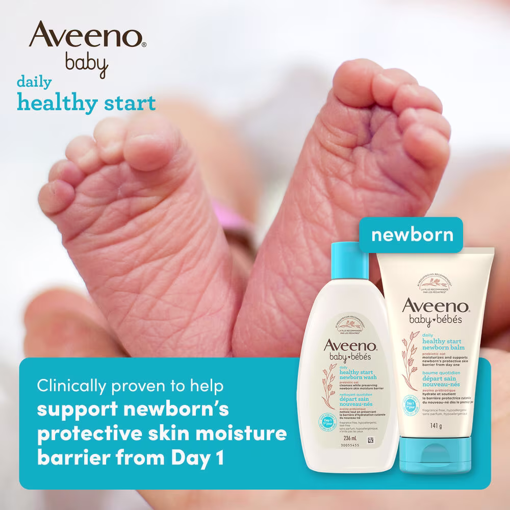 Front shot of Aveeno® Baby Healthy Start Newborn Wash and Balm products and a newborn baby's feet in the background