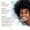 Smiling child with curly hair enjoys bath time with bubbles + 3 Steps of hair wash text