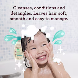 Smiling child in bath using the AVEENO® Kids Hydrating Shampoo & Conditioner