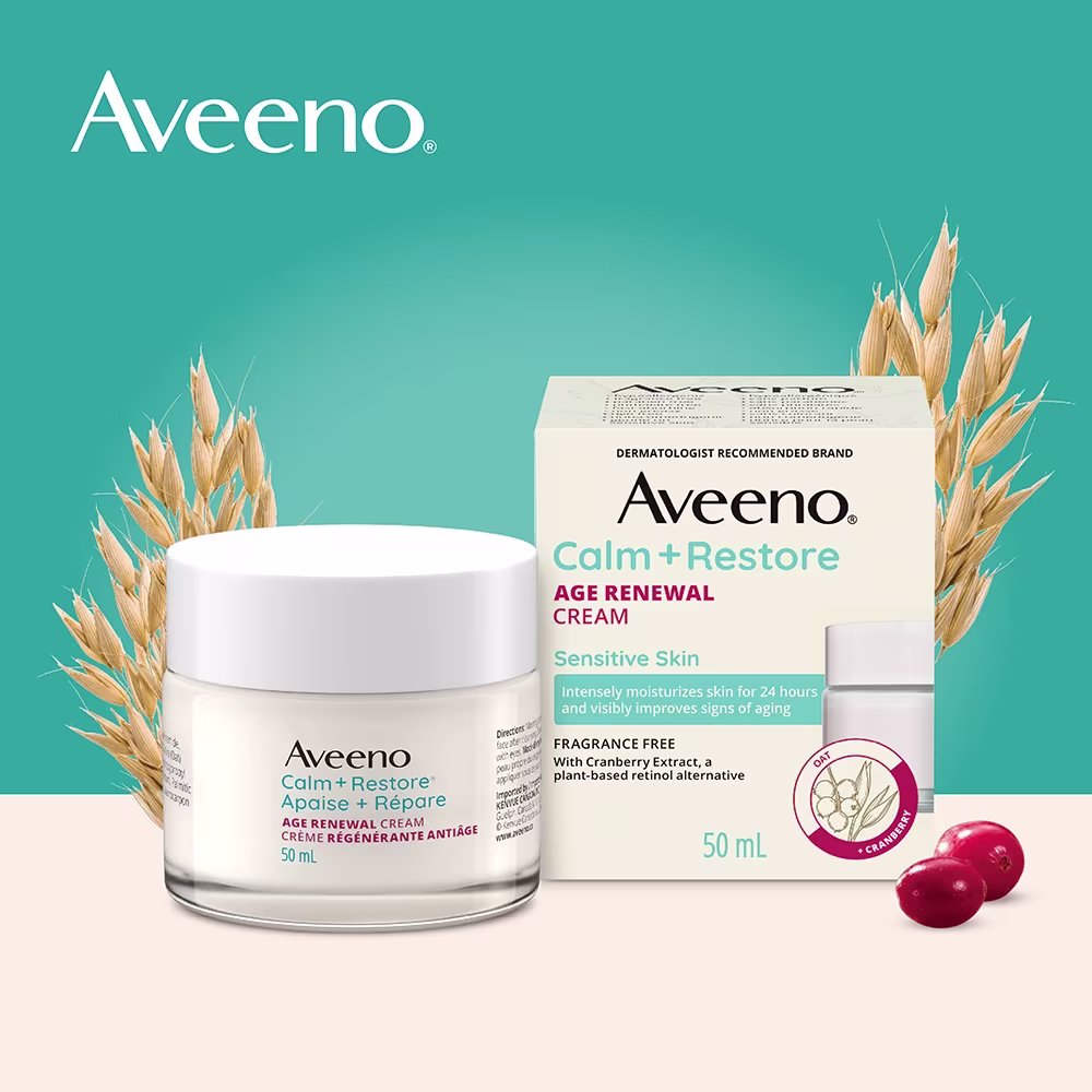 JS4452-AV-CR-AgeRenewalEcommTiles-ENG-4000x4000-1 The front shot of the AVEENO® Calm + Restore Age Renewal Face Cream product jar and packaging along with oats and cranberries