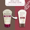 Un ancien et un nouveau tube à presser de 97 ml de la crème à mains Ultrasoins Aveeno avec la mention « Nouveau look, flacon plus écologique »