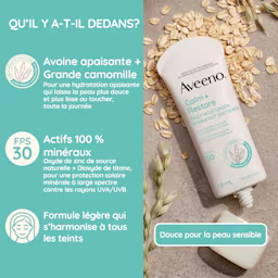 Hydratant quotidien avec écran solaire minéral FPS 30 Aveeno® Calm + Restore, tube à presser, bouchon ouvert, sur des flocons d’avoine