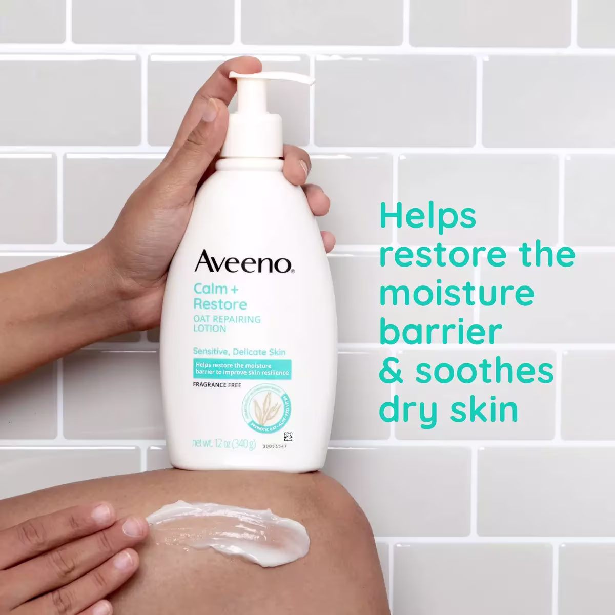 Close up of person holding Calm + Restore Oat Repairing Lotion, applying it on leg with claim "Helps restore the moisture barrier & soothes dry skin"