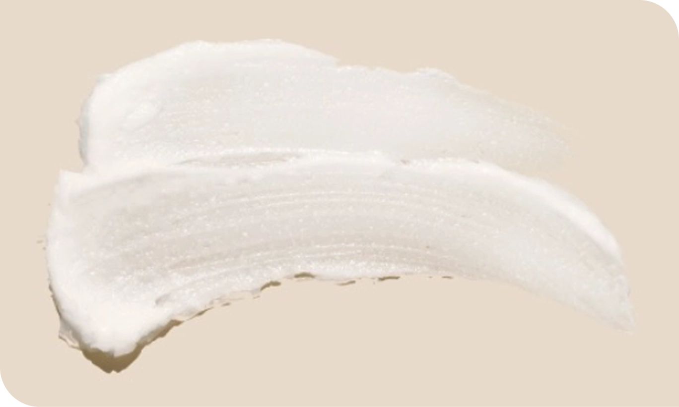 Image highlighting shea butter texture, clean and cream smooth texture.