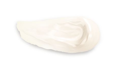 A swatch of white cream on a black background