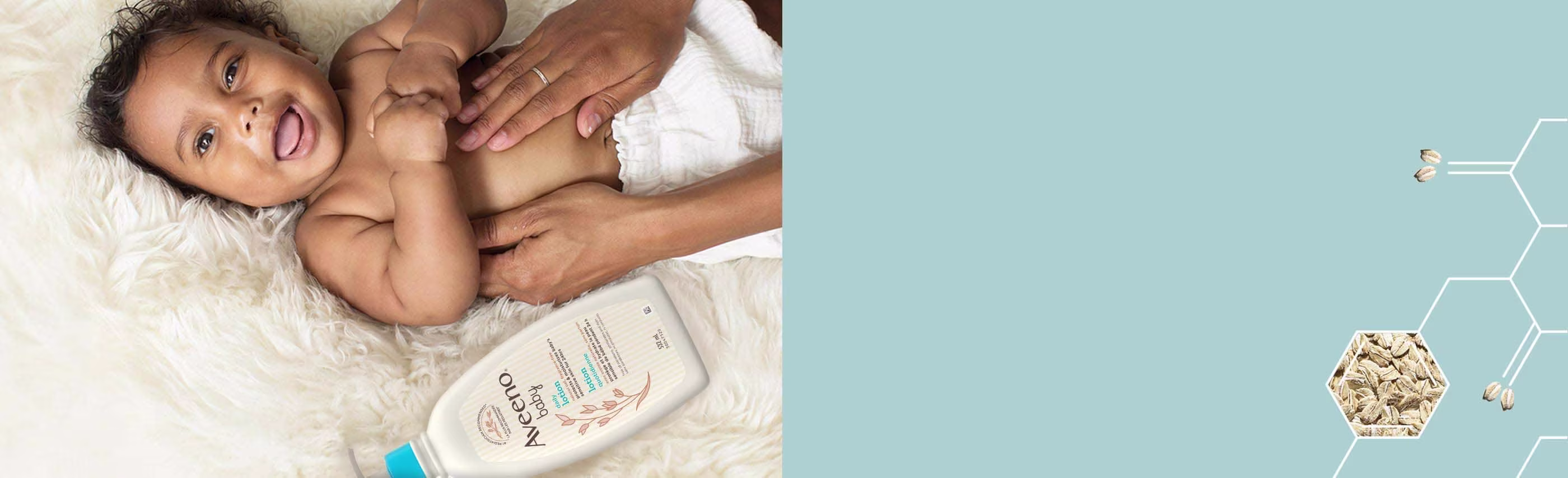 Mother Applying AVEENO® BABY Daily Lotion with Natural Collodial Oat on Smiling Baby