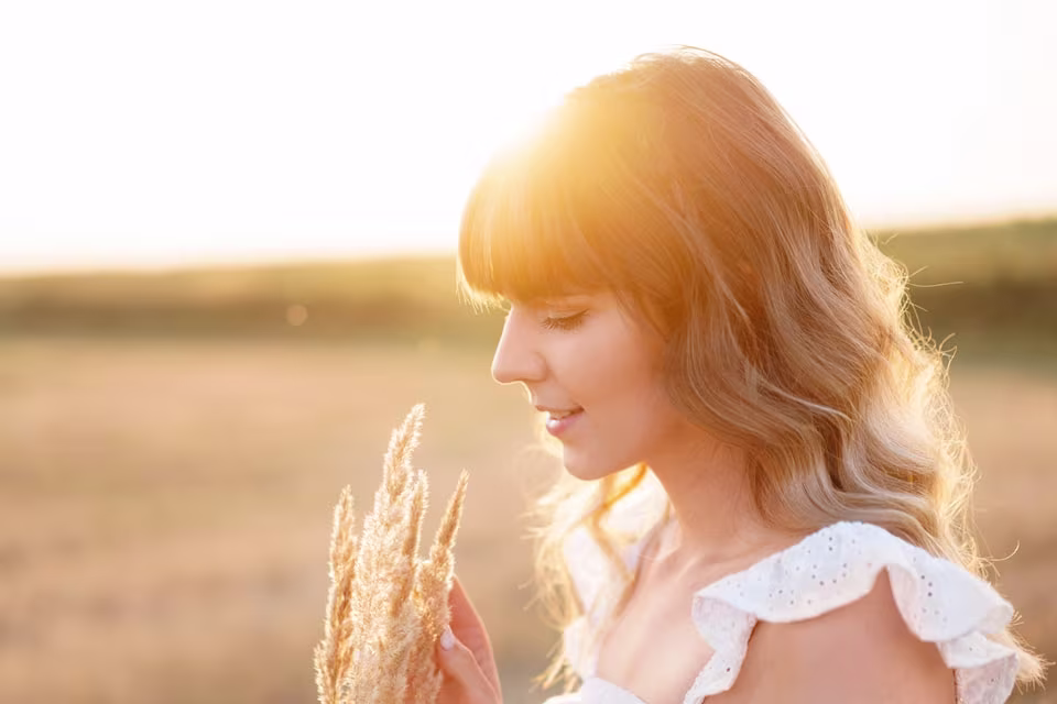 sideview of woman holding oats