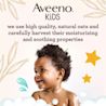 Aveeno® Kids banner with a kid with coily hair smiling and some text highlighting the product line
