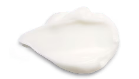 White cream on a white surface showcasing a soft, thicker texture