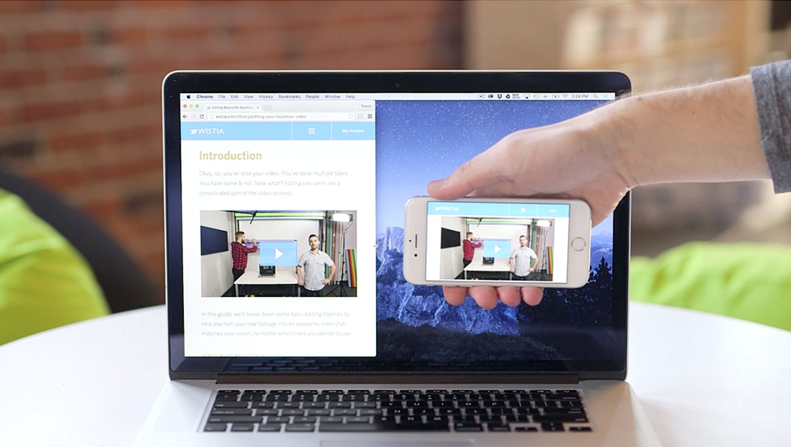 mobile phone over a computer comparing the player on mobile and desktop