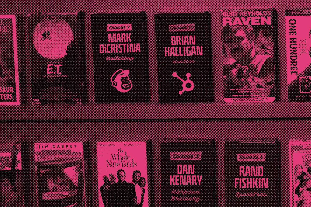 VHS cases on a shelf with some labeled with Brandwagon guests.