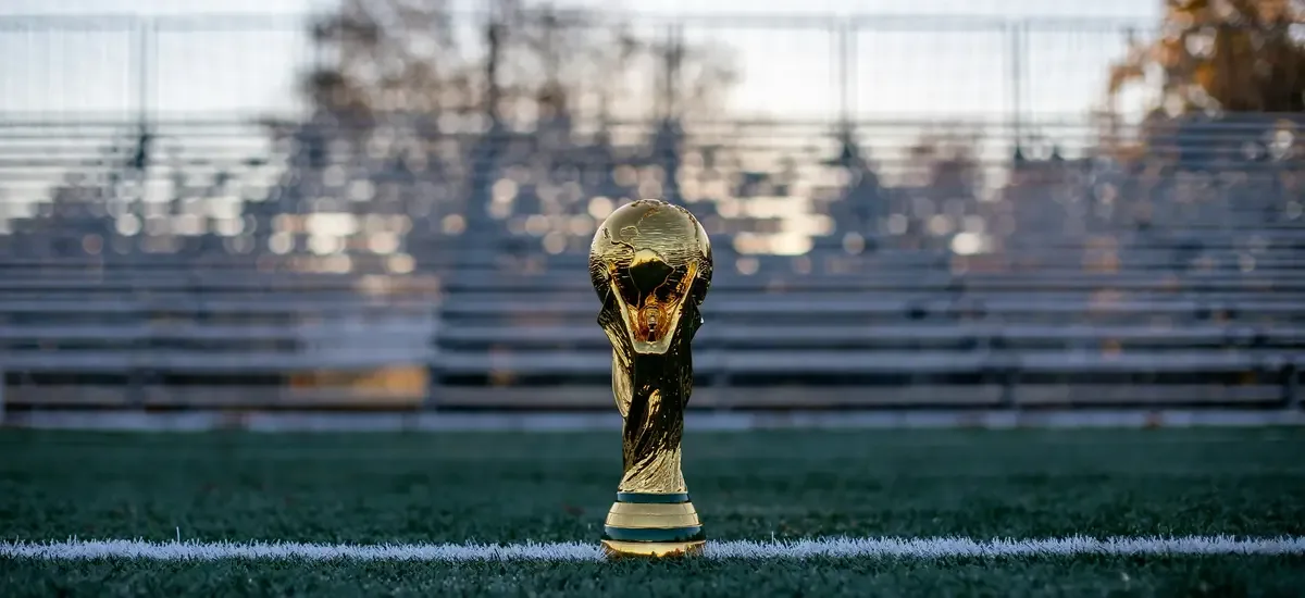 World Cup trophy on a football pitch