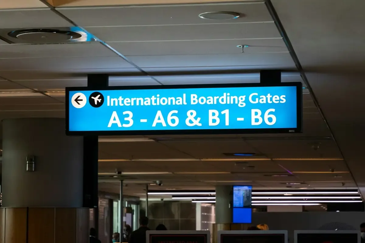 International boarding gate screens at an airport