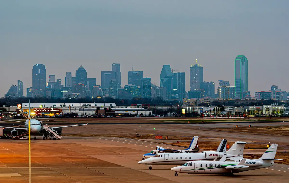 airport runway, planes, and buildings
