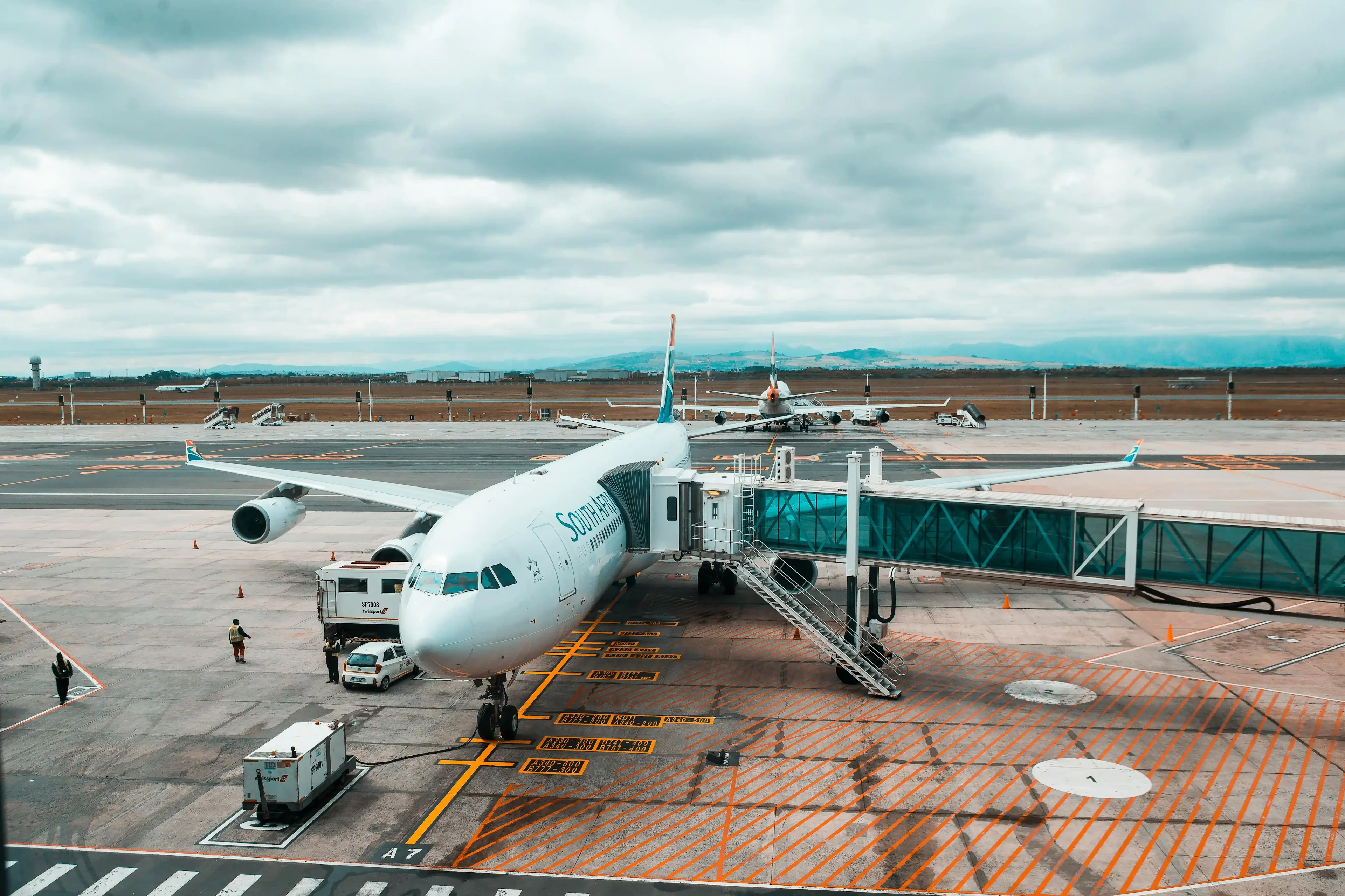 The white airplane located at the airport