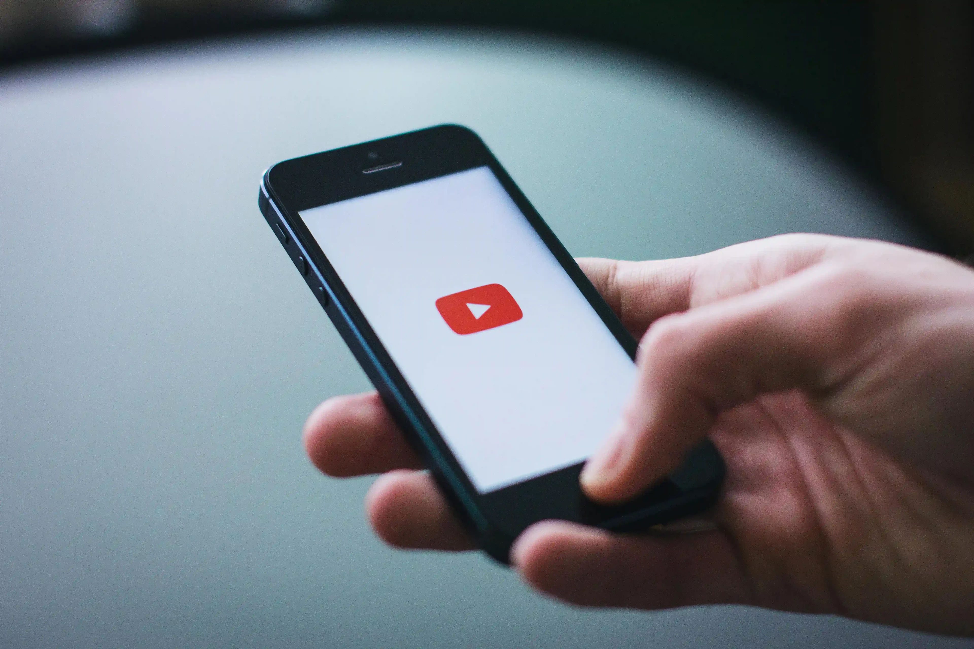 YouTube logo on a phone screen