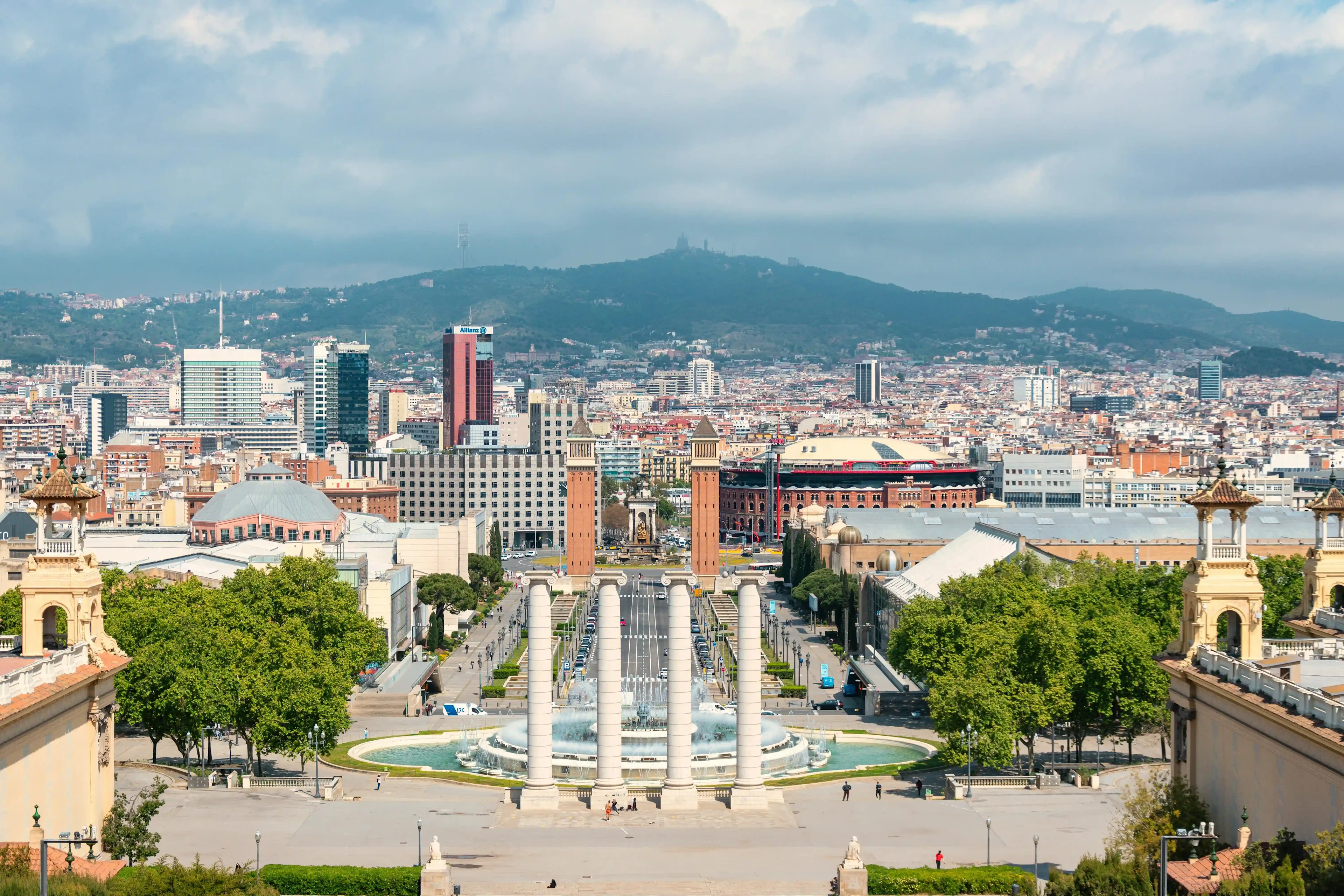 A daytime view of Barcelona with towers and houses