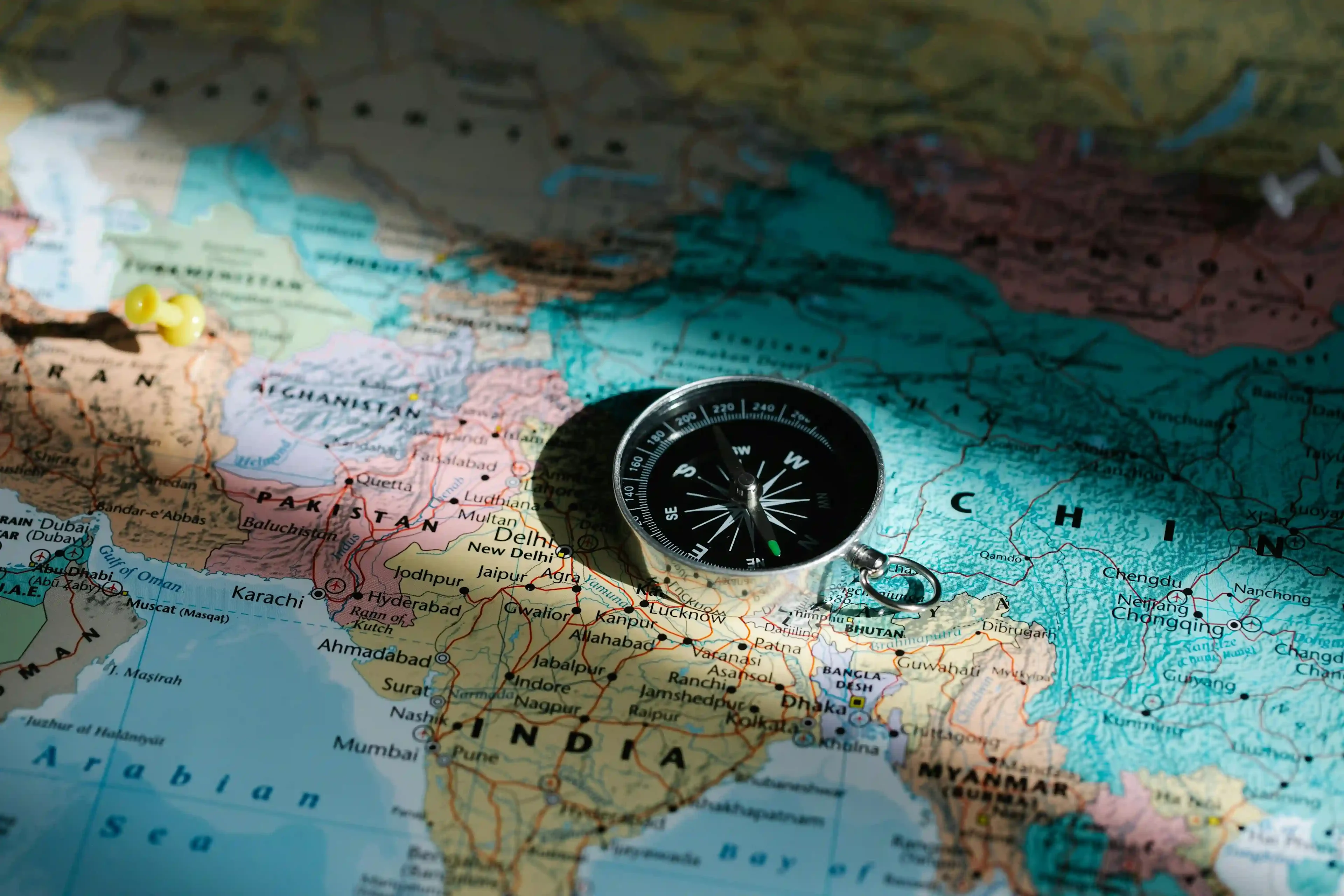world map and compass
