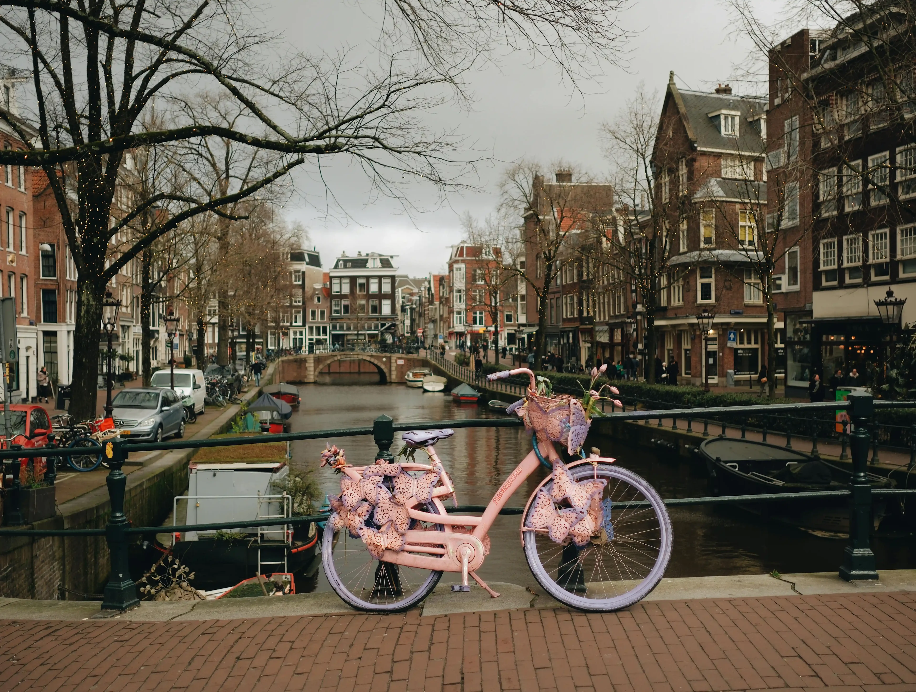 A bicycle parked on a bridge in Amsterdam