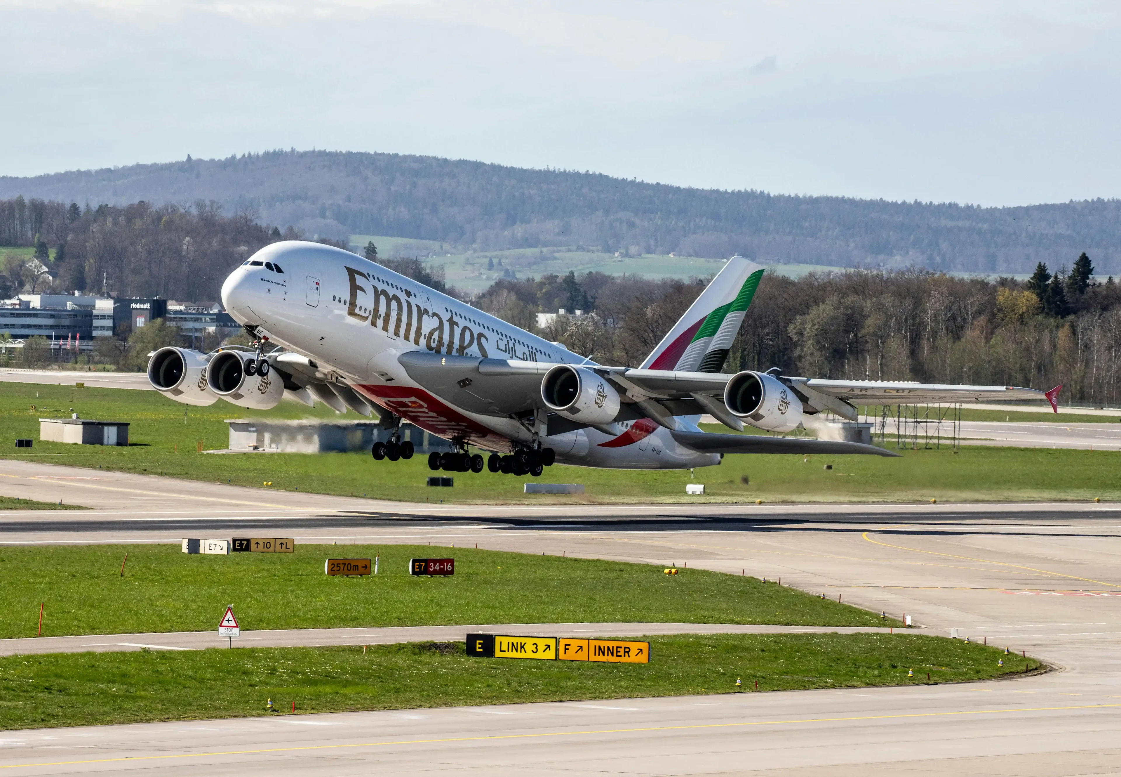 The plane taking off from the runway