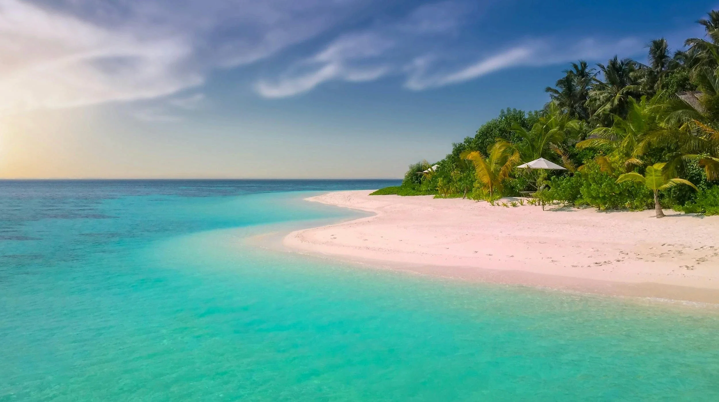 A view of beach and sea on a sunny day