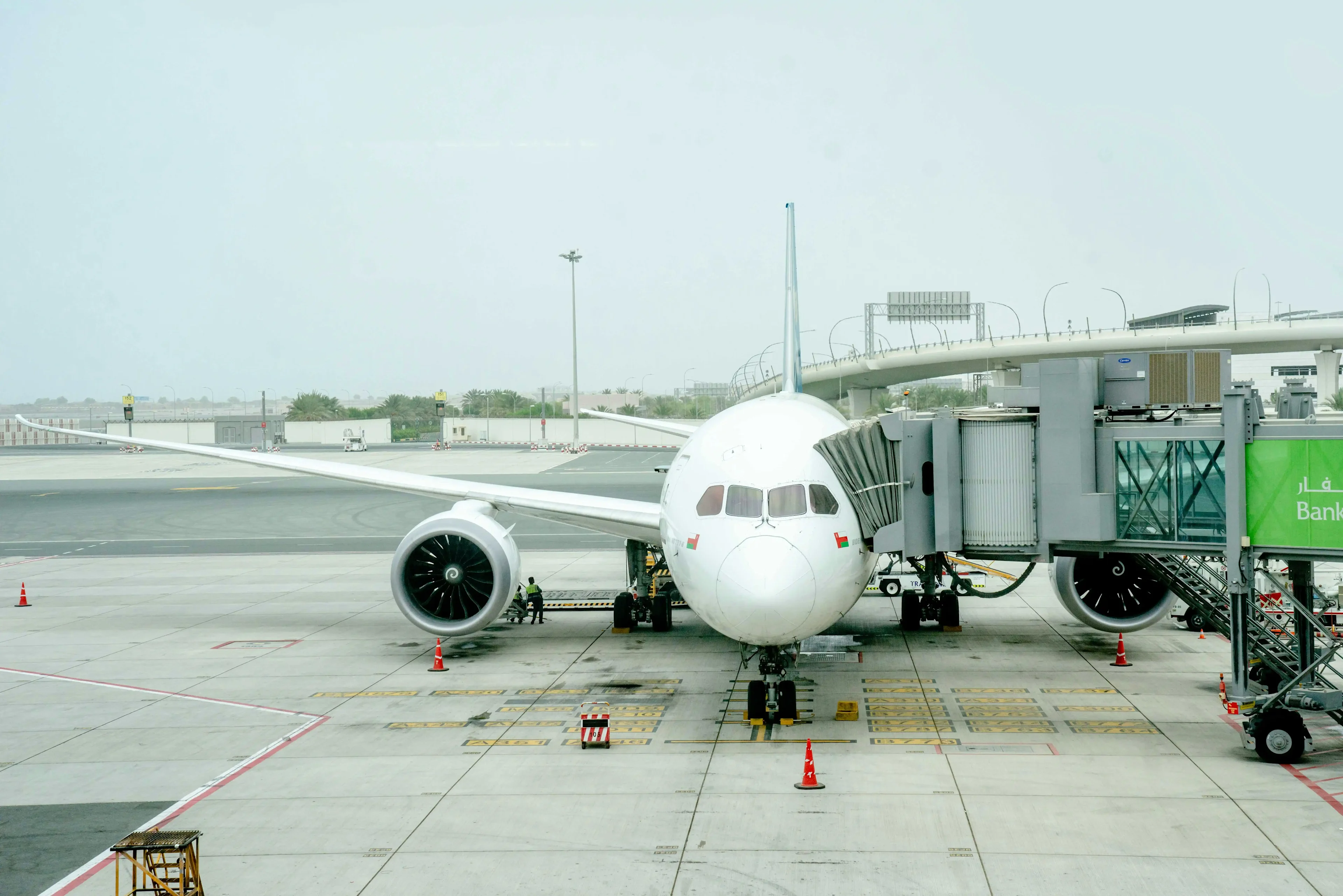 The white plane on the airport's runway.