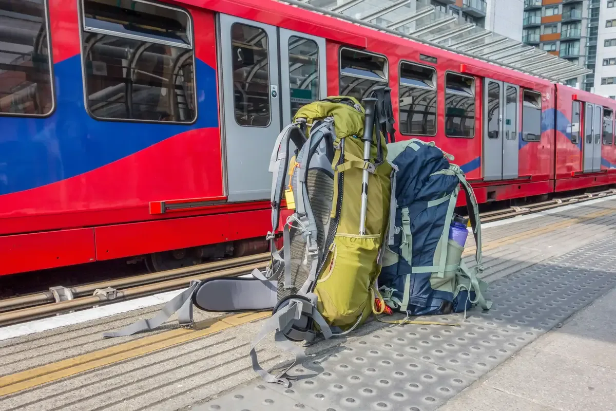 travel backpacks and a train