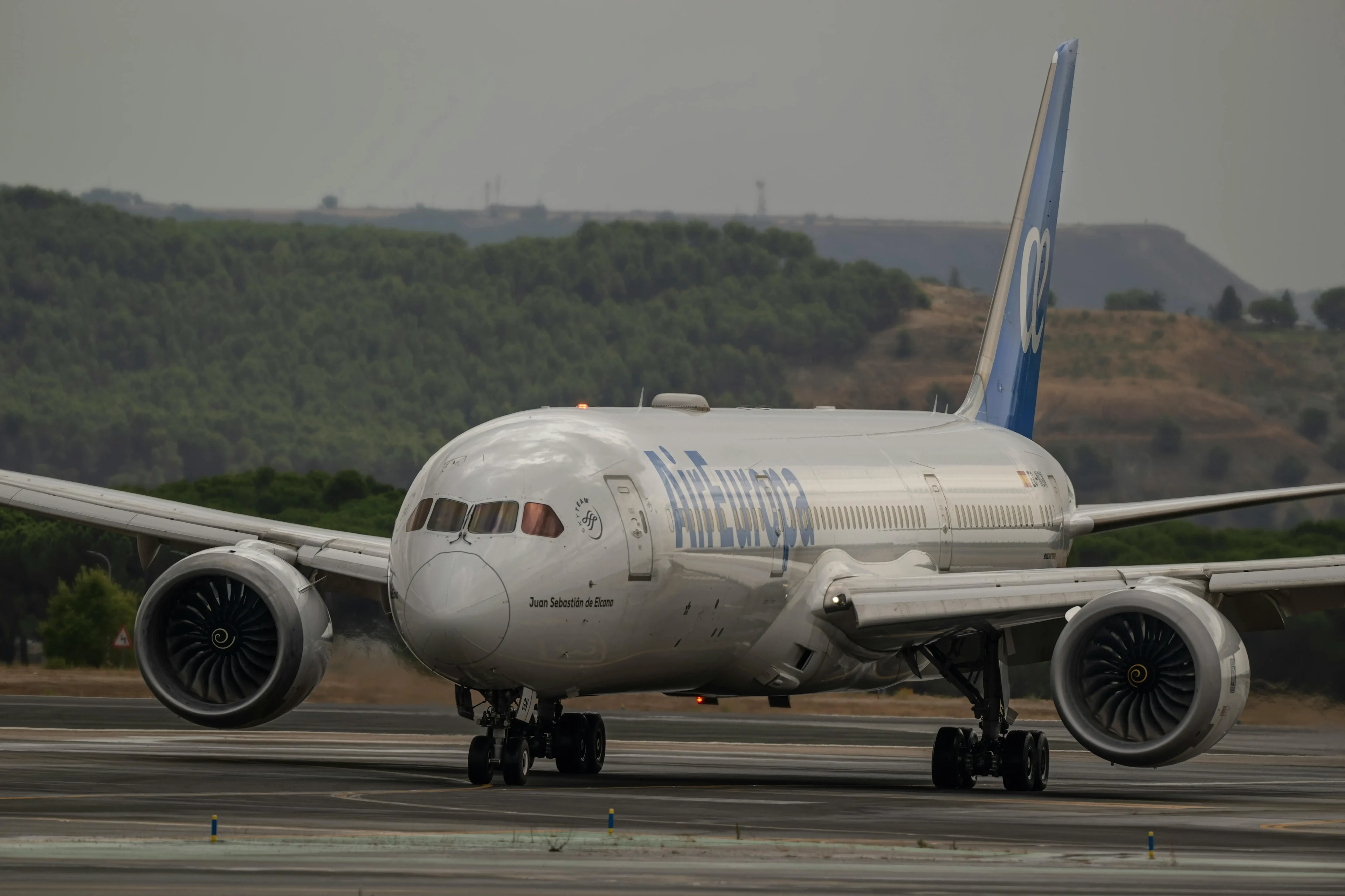 The white plane taking off on the runway
