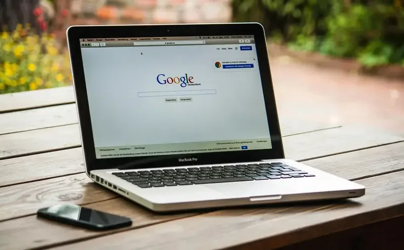 laptop and smartphone on table