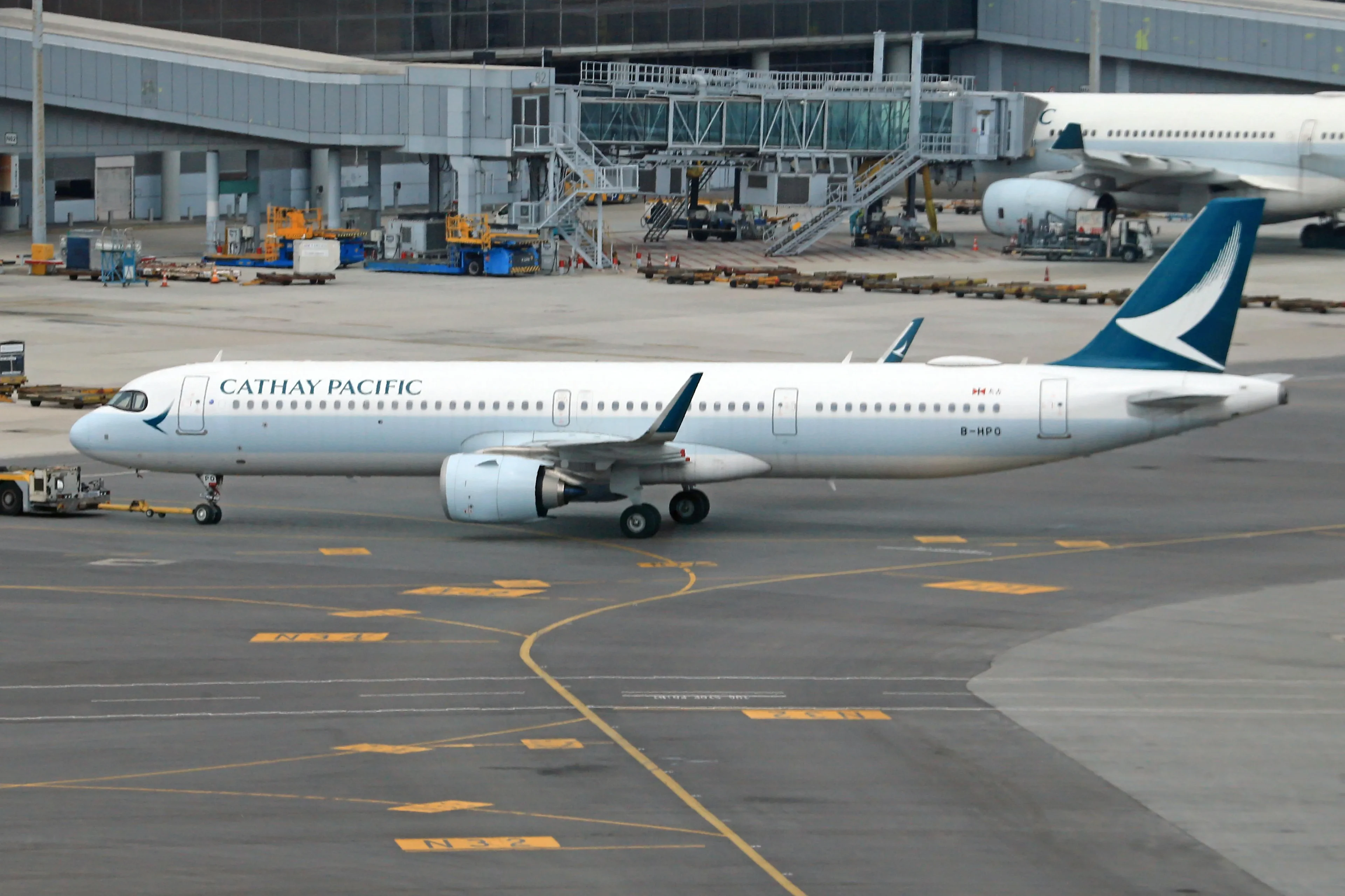 blue-winged plane waiting at the airport