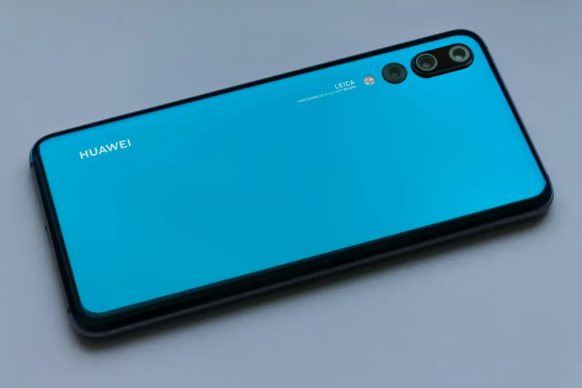 Blue Huawei smartphone showing its back with dual camera and Leica branding