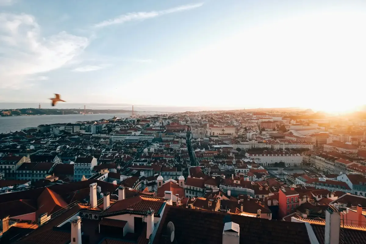 Sunset view over Lisbon’s rooftops and the Tagus River