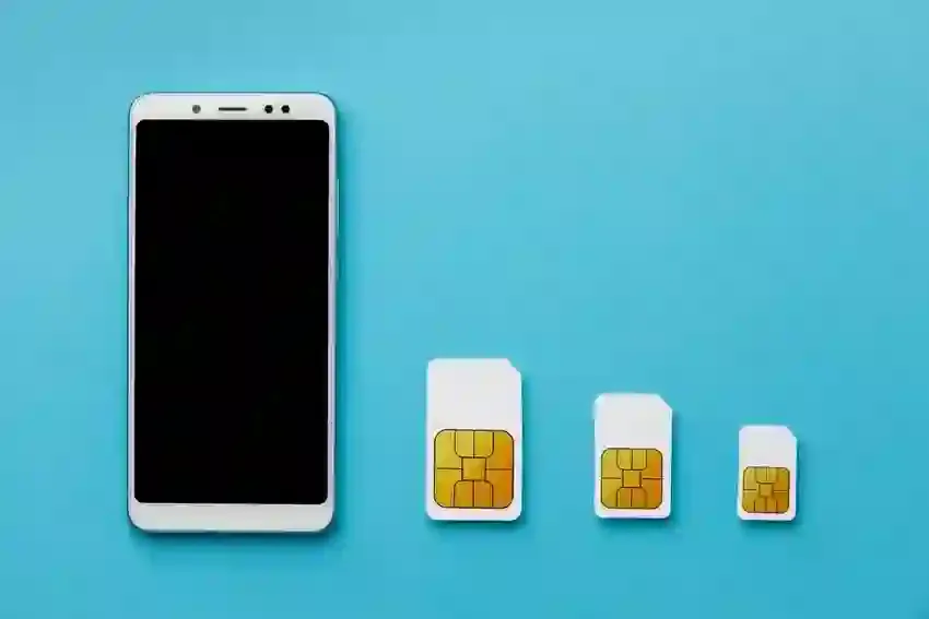 smartphone next to 3 different types of physical sim cards