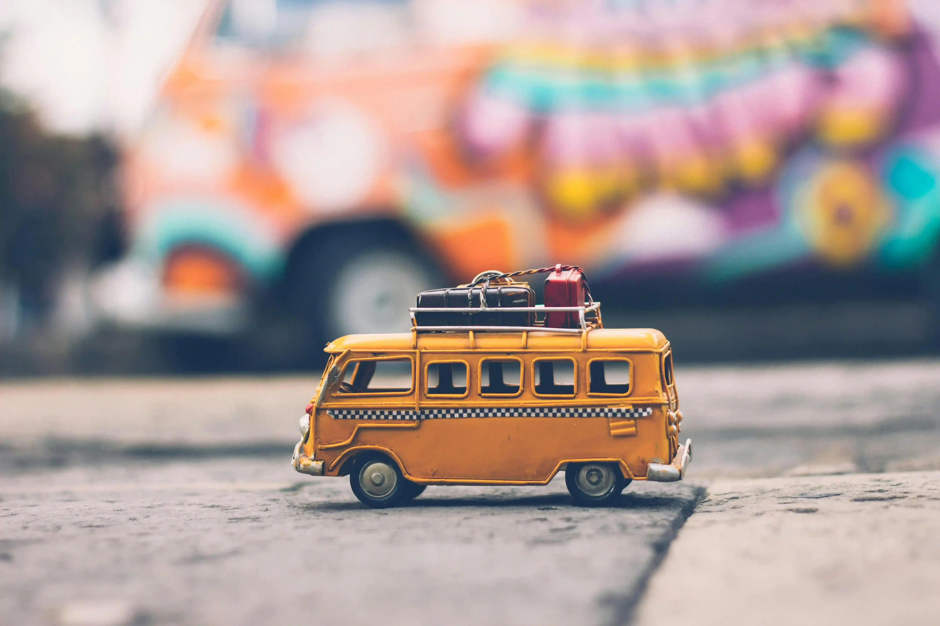 a toy caravan and suitcases