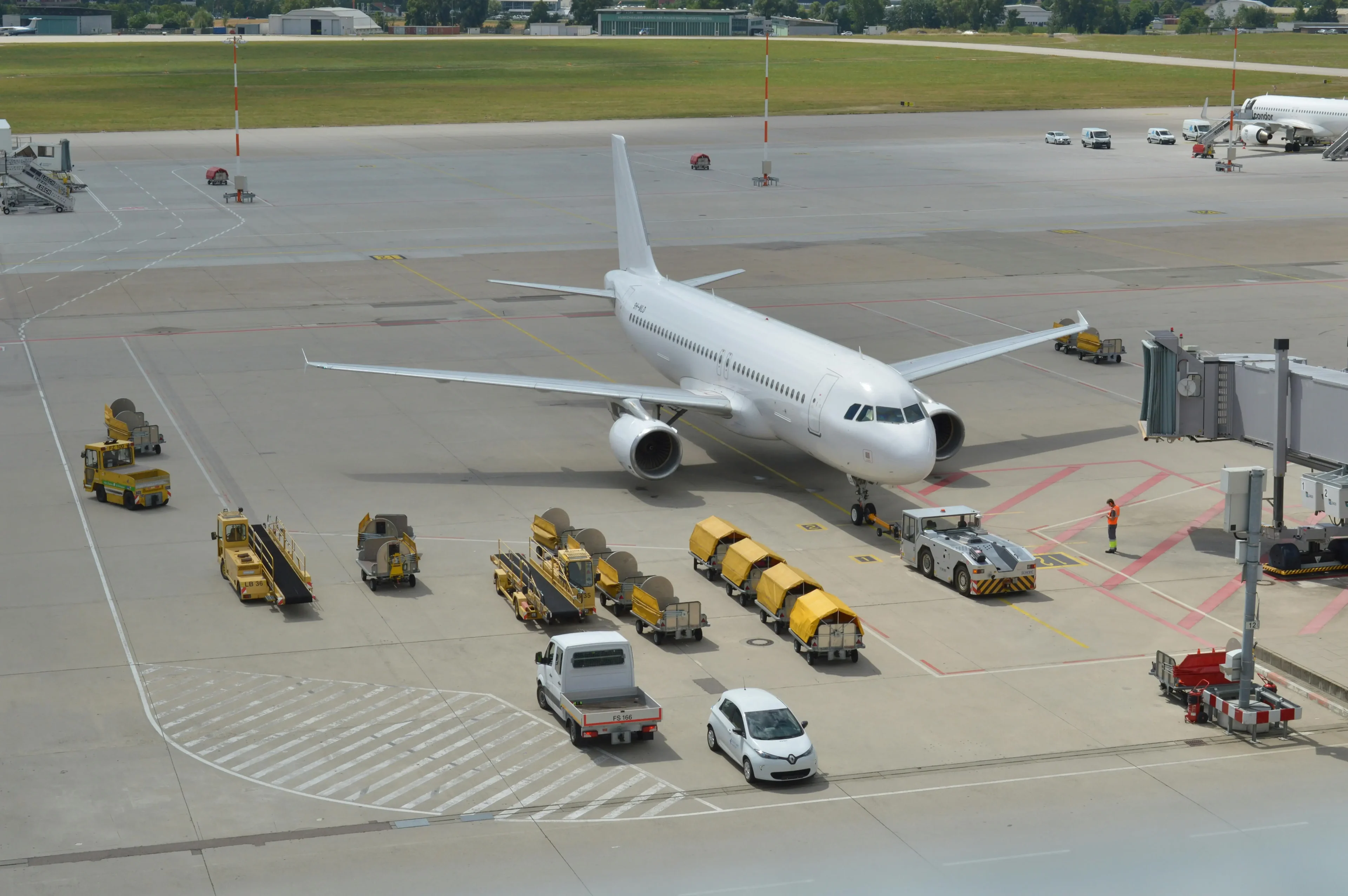 The white plane located in the airport terminal