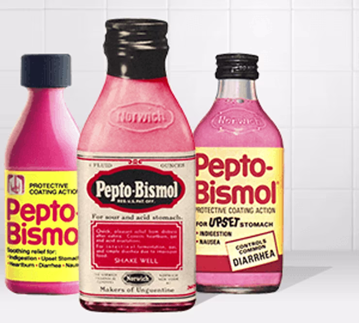 Three old Pepto-Bismol glass bottles on a white background.