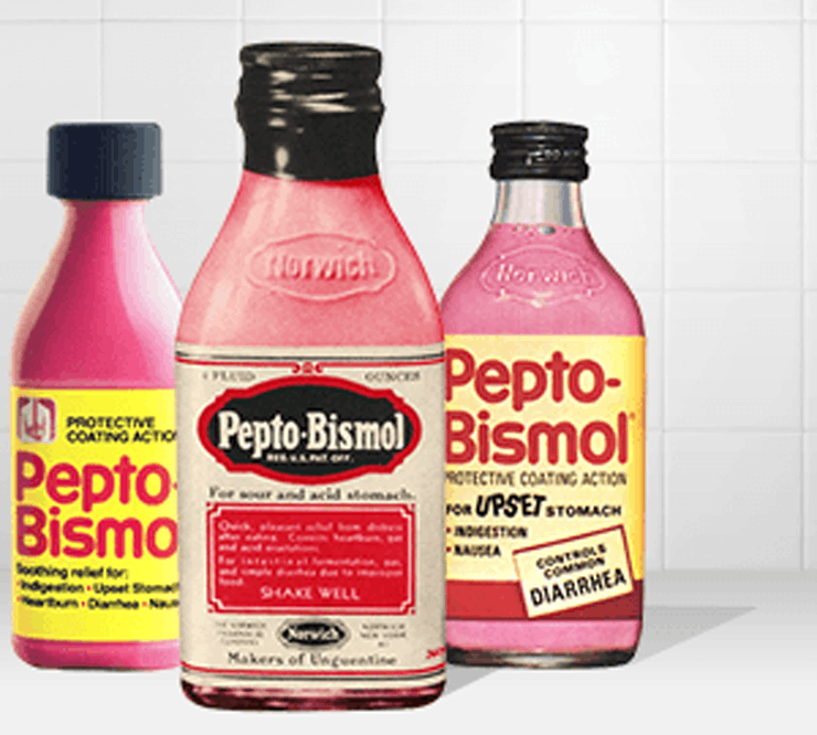 Three old Pepto-Bismol glass bottles on a white background.