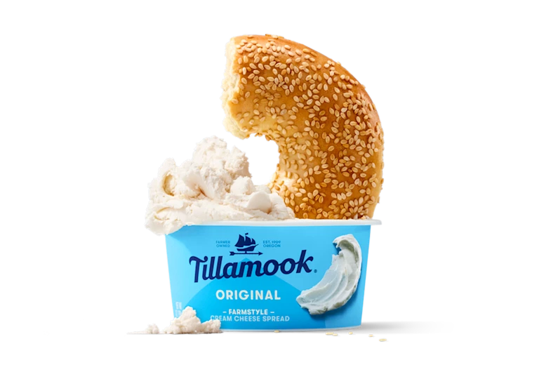 Tillamook Cream Cheese with Bagel dipped in